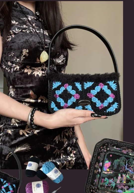 Black crochet handbag with blue and purple floral squares